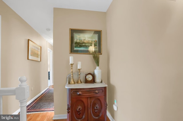 hallway with wood-type flooring