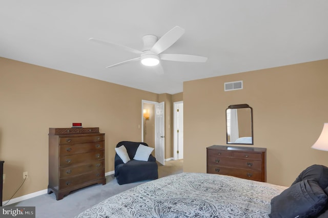 bedroom featuring light colored carpet and ceiling fan