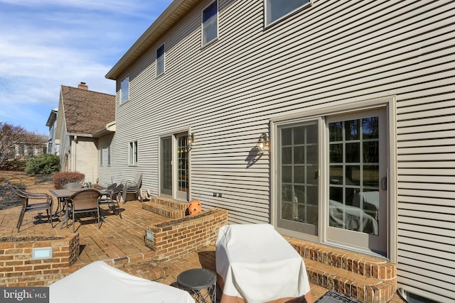 exterior space with a grill and a patio area