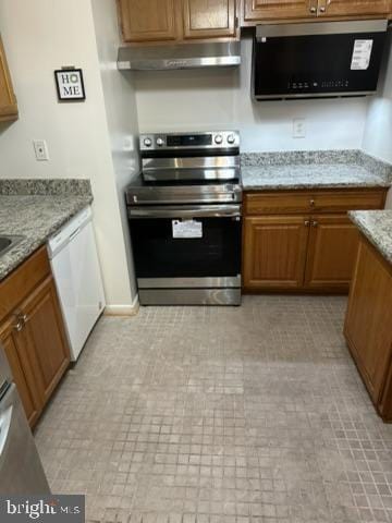 kitchen featuring light stone counters, dishwasher, range hood, and stainless steel electric range