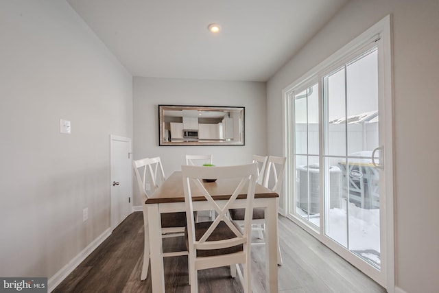 dining area with hardwood / wood-style flooring