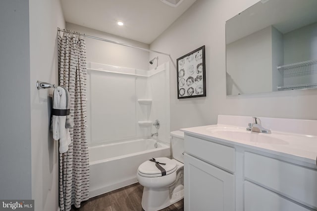 full bathroom with toilet, wood-type flooring, vanity, and shower / bath combo with shower curtain