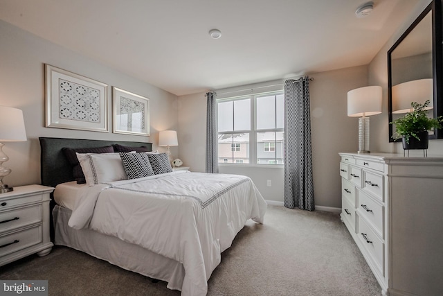 bedroom featuring light carpet