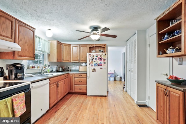 kitchen featuring ceiling fan, white appliances, a textured ceiling, light hardwood / wood-style flooring, and sink