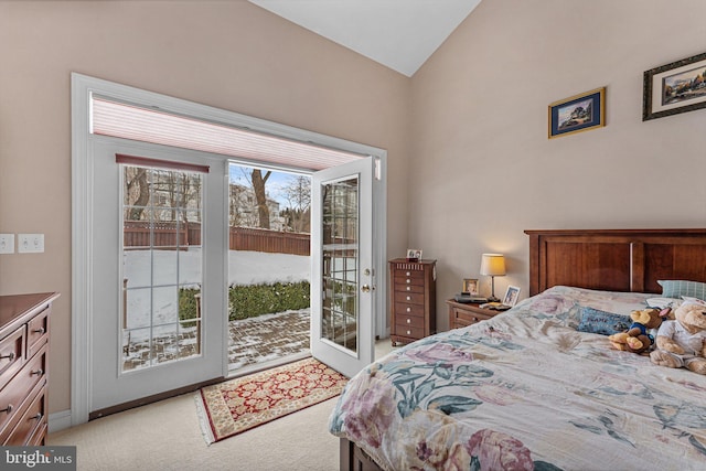 bedroom with light carpet, access to exterior, and lofted ceiling