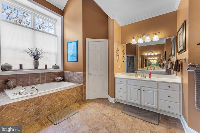 bathroom featuring vanity, crown molding, and shower with separate bathtub