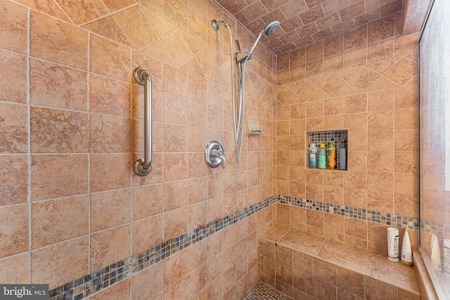 bathroom featuring tiled shower