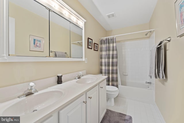 full bathroom with toilet, shower / tub combo, tile patterned floors, and vanity