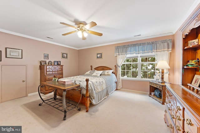 bedroom with ceiling fan, ornamental molding, and light carpet