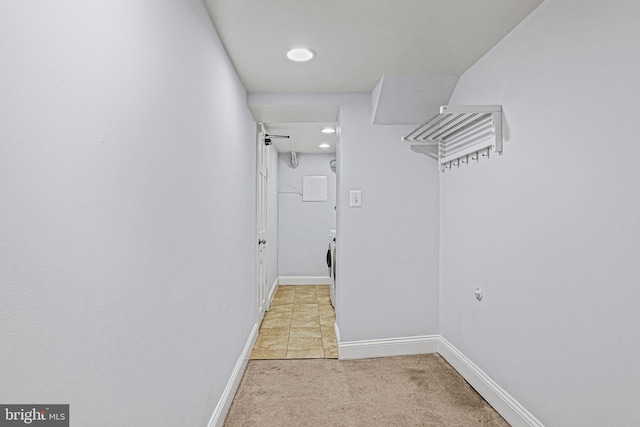 walk in closet with light tile patterned flooring