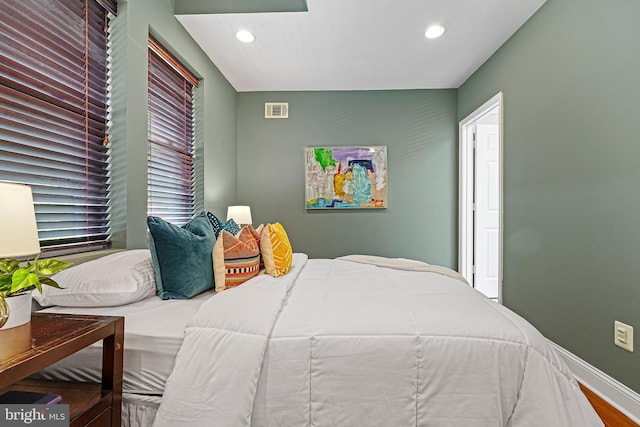 bedroom with hardwood / wood-style floors