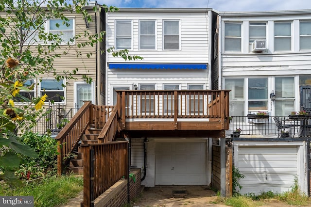 back of property featuring a garage