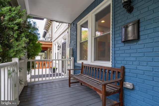 wooden deck featuring covered porch