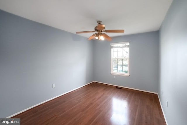 empty room featuring hardwood / wood-style flooring and ceiling fan