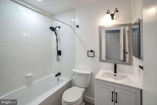 full bathroom featuring vanity, toilet, and tiled shower / bath