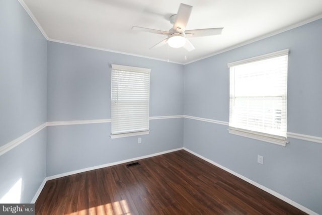 spare room featuring ceiling fan, dark hardwood / wood-style flooring, and ornamental molding