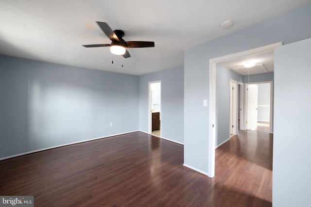 unfurnished room featuring dark hardwood / wood-style floors and ceiling fan