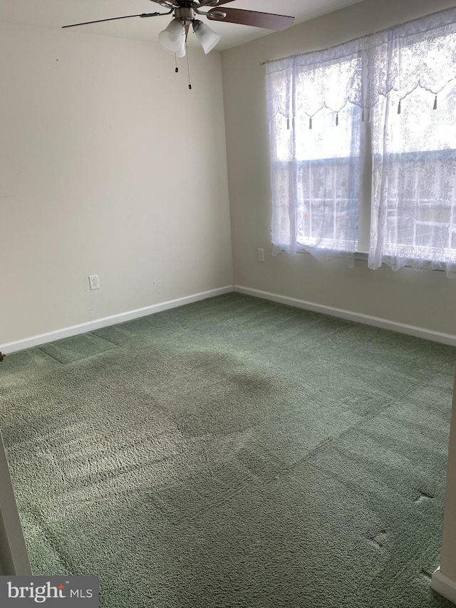 carpeted empty room with ceiling fan