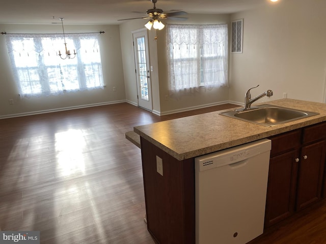 kitchen featuring sink, dishwasher, pendant lighting, ceiling fan with notable chandelier, and a kitchen island with sink