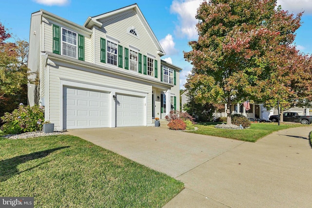 view of front facade with a garage and a front lawn