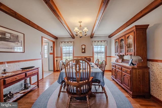 dining room with a notable chandelier and light hardwood / wood-style floors