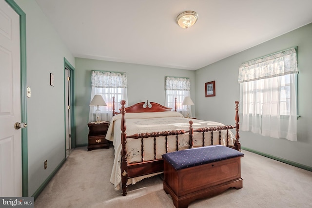 bedroom featuring light colored carpet