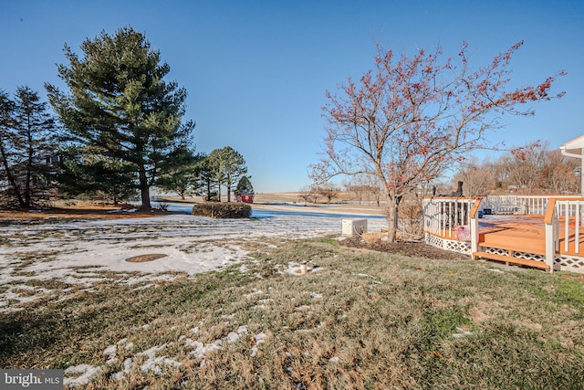 view of yard featuring a deck with water view