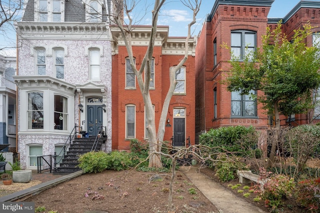 victorian home with brick siding