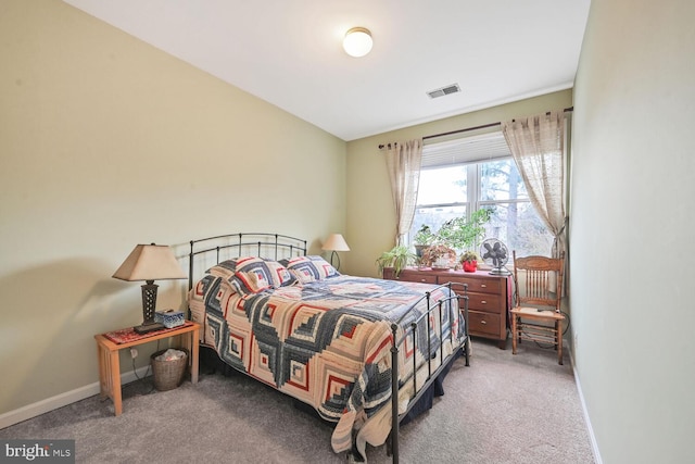 bedroom with baseboards, visible vents, and carpet floors