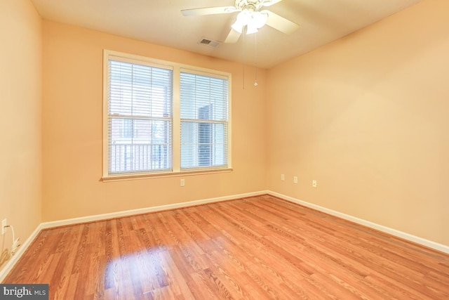 unfurnished room with ceiling fan and light hardwood / wood-style flooring