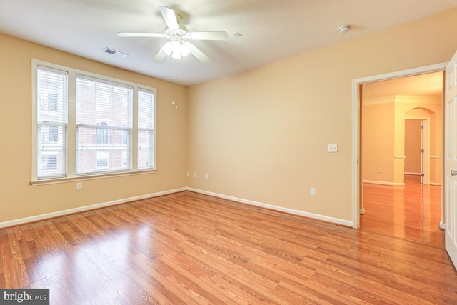 unfurnished room featuring ceiling fan and light wood-type flooring