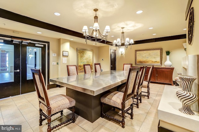 dining space featuring light tile patterned floors and a chandelier