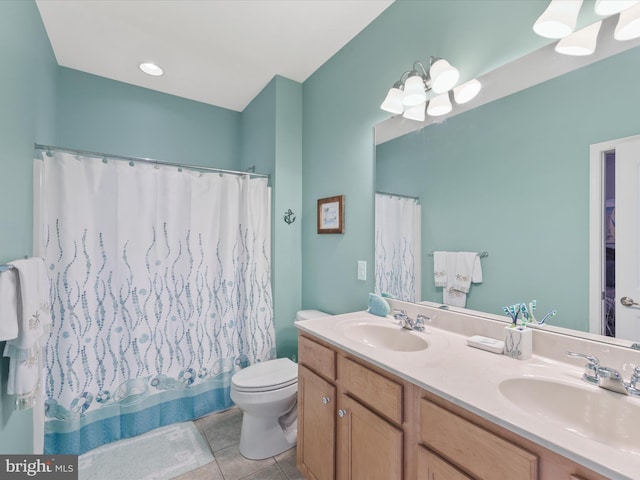 full bathroom featuring tile patterned floors, vanity, toilet, and shower / bathtub combination with curtain