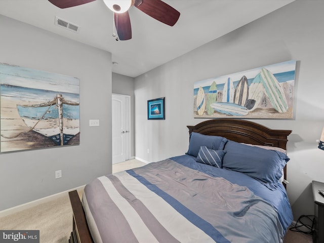 bedroom featuring ceiling fan and light colored carpet