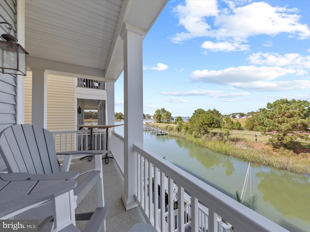 balcony featuring a water view