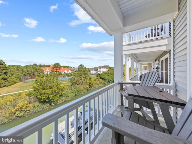 balcony featuring a water view