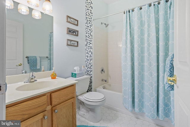 full bathroom featuring shower / bath combo, vanity, and toilet