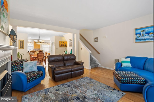 living room featuring hardwood / wood-style flooring and a notable chandelier