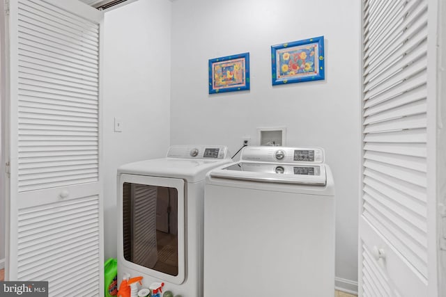 washroom featuring separate washer and dryer