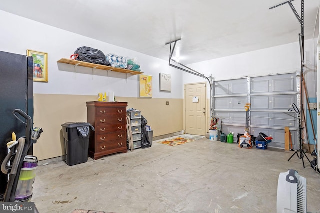 garage featuring black fridge