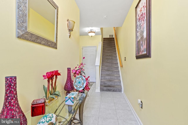 corridor featuring light tile patterned floors