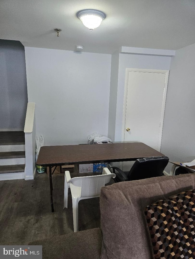 dining space with dark wood-type flooring