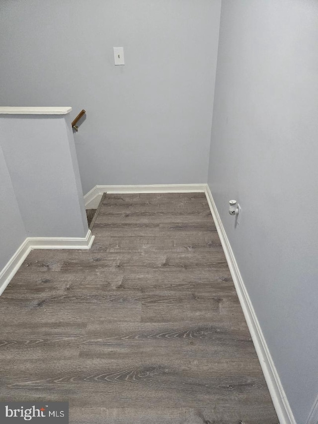 stairs featuring hardwood / wood-style flooring