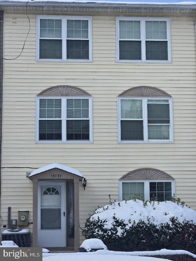 view of front of house featuring central air condition unit