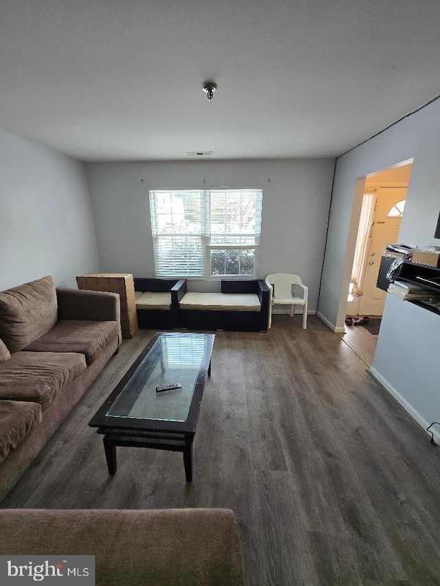 living room with dark wood-type flooring