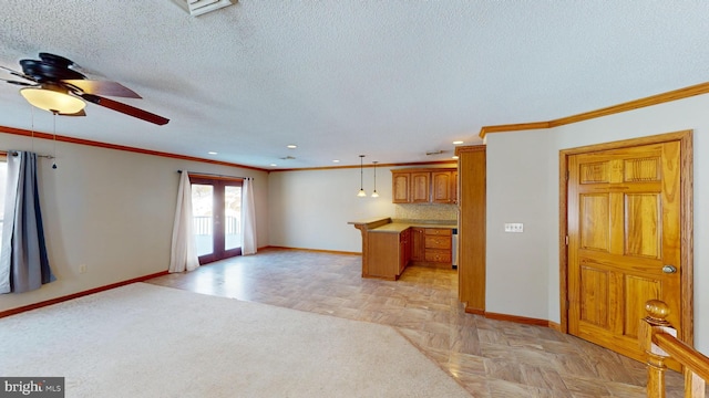 unfurnished living room featuring crown molding and baseboards