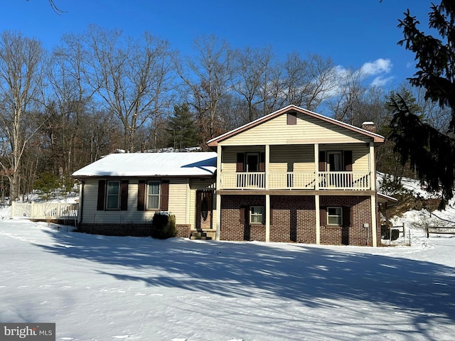 split level home featuring brick siding