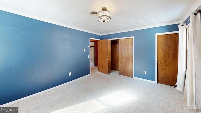 unfurnished bedroom featuring light carpet, crown molding, visible vents, and baseboards