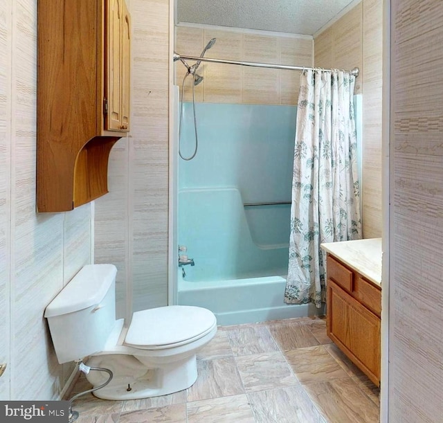 bathroom featuring a textured ceiling, shower / bathtub combination with curtain, toilet, and vanity