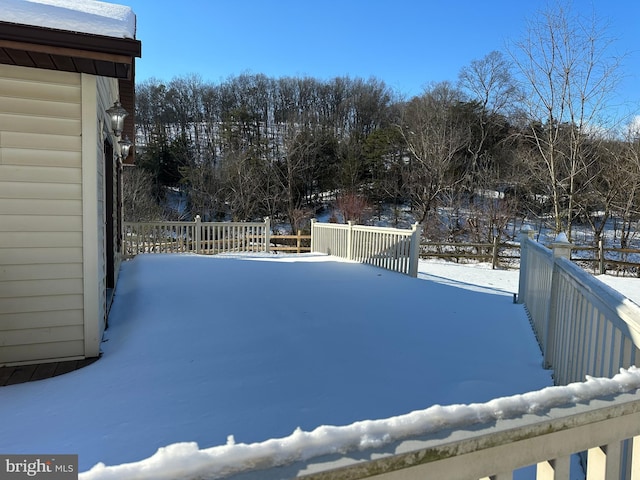 view of yard layered in snow